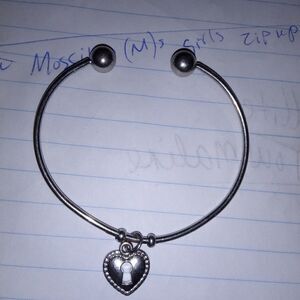 Silver cuff bracelet with one heart charm